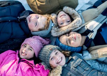 group of children with winter coats and hats